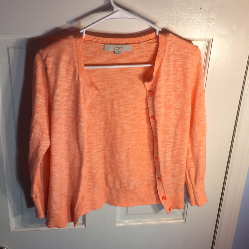 Orange cardigan.